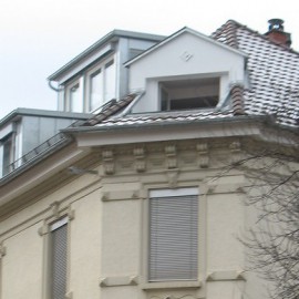 Sanierung des Dachgeschosses an einem Jahrhundertwende-Wohnhaus mit neuen Gauben und Dachterrassen